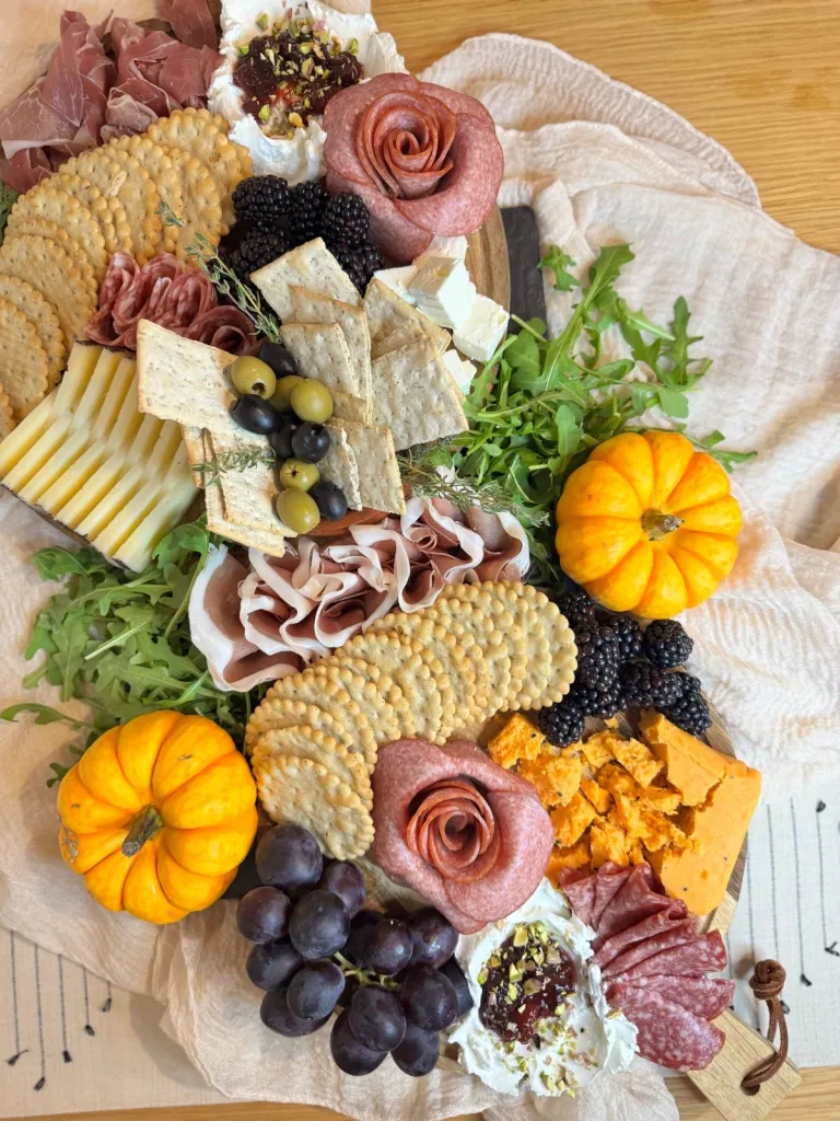 Still the office expert in interiors, hosting, and exceptionally good cheeseboards.